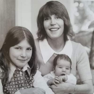 Helen Reddy is holding her son Jordan Sommers while Traci Wald Donat is sitting next to her for the picture.
